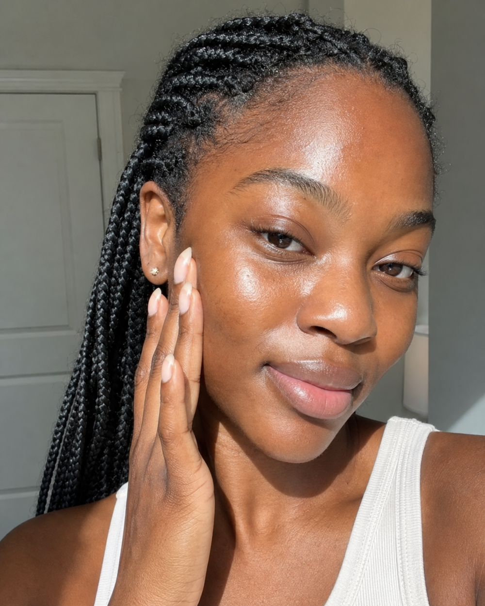 Beauty products arranged on a personal skincare shelf